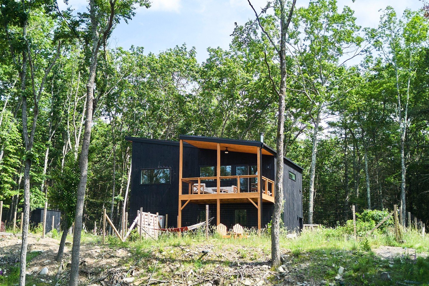 The Black Forest Club is one of Sullivan County's gems: a private 1,100-acre community with its own hiking trails, waterfalls, swimming holes, and Delaware River access. Mill Brook puts you right in the heart of it, on nearly 10 acres above your own 