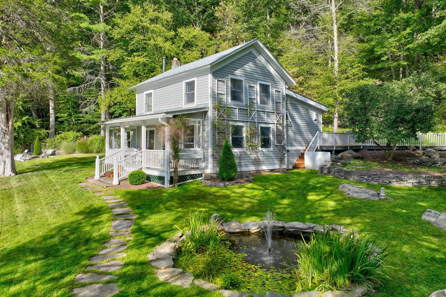 From the front porch of this c.1900 Pennsylvania farmhouse, the Lackawaxen River is a constant presence: the sound of it drifting through the air, the light shifting across the water through every season, and eagles foraging from overhead. ⁠
⁠
Inside