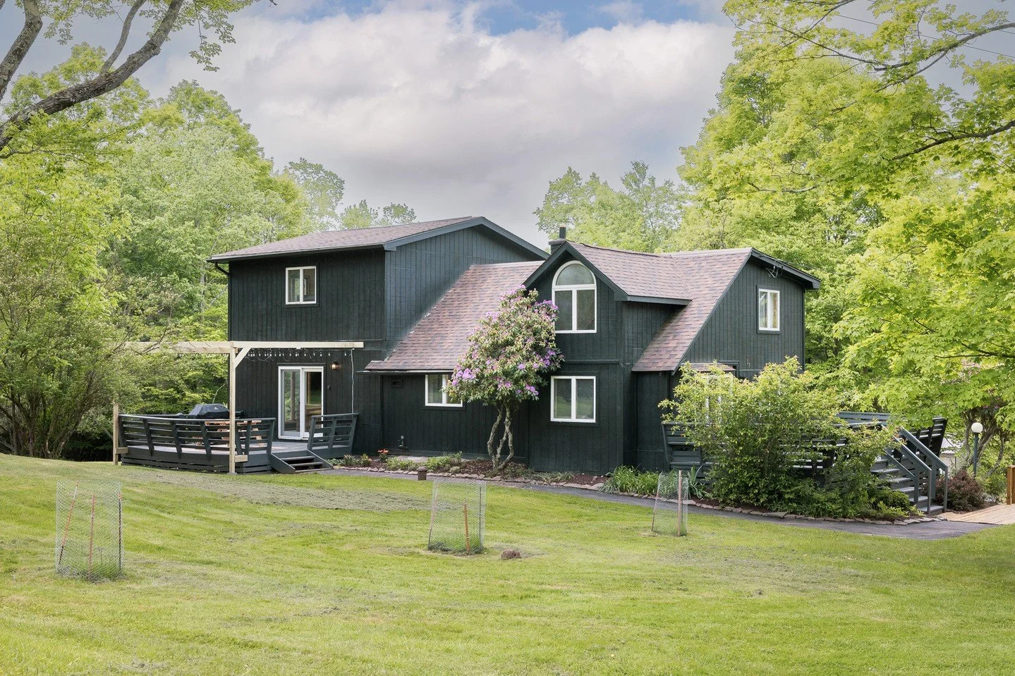 💫 NEW A 1940's home on a quiet country road in Jeffersonville, completely reimagined from the outside in. The sharp black exterior sets the tone, and the interior delivers: vaulted ceilings, terrazzo tile, a new kitchen with a large island, and a bu