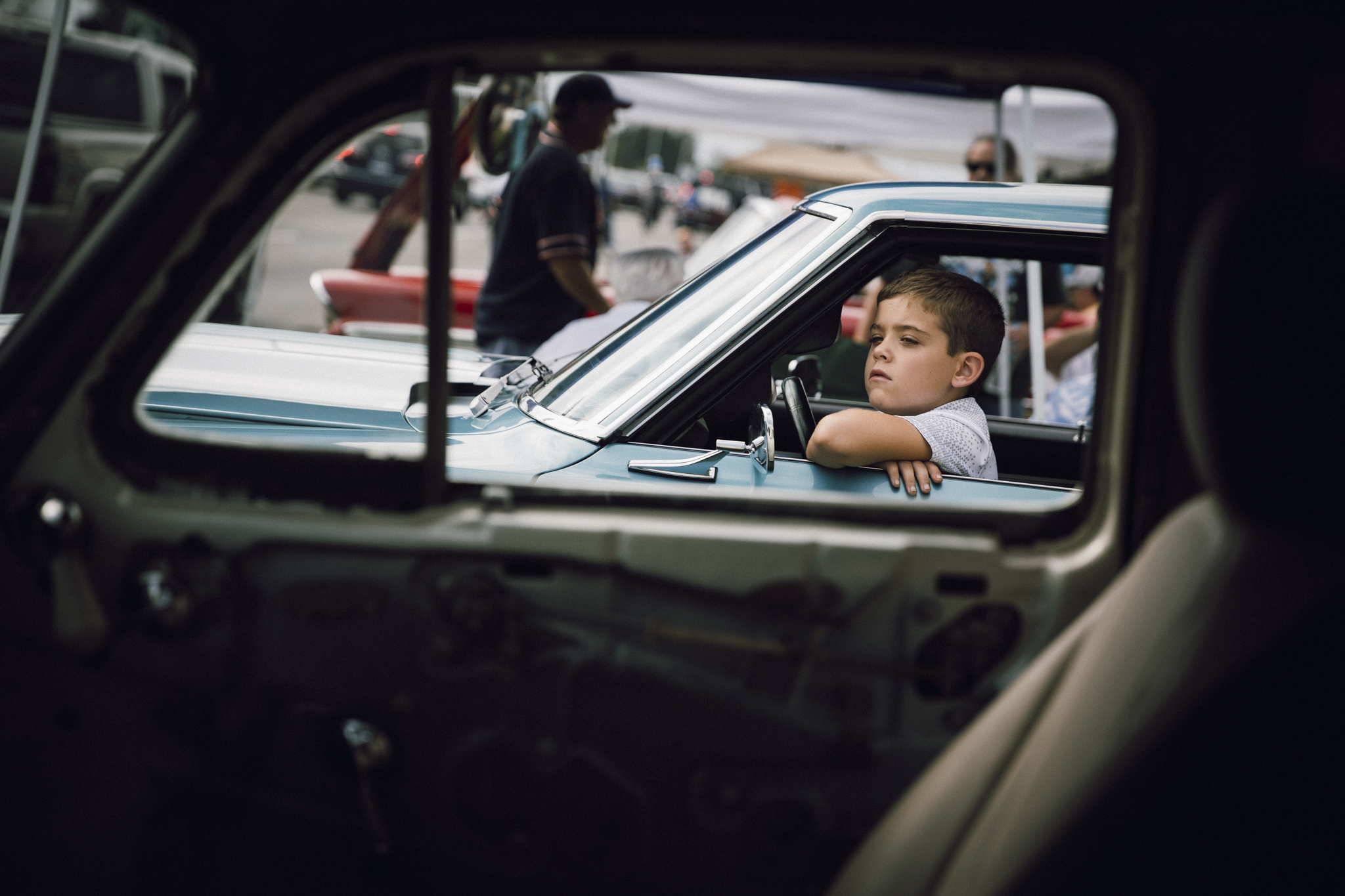 After photographing this boy at Dream Cruise, I walked up to him and asked which car was his favorite. He looked up at me, patted the door and said, "this one."