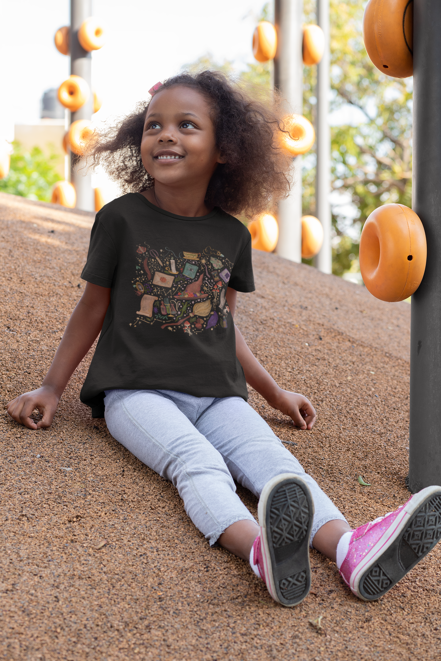 mockup-of-a-little-girl-wearing-a-t-shirt-at-a-park-32177 2.PNG