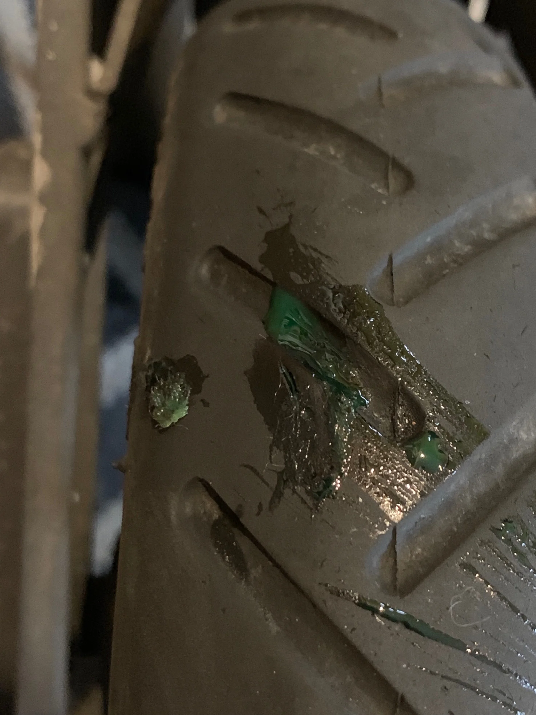 Tyre slime emerging from a puncture, sufficient to get me home with decent tyre pressure.