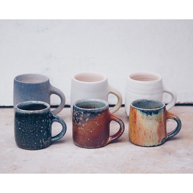 Three__espresso_cups__before_being_fired_and_after._A_red_shino_with_a_cobalt_and_black_stain_sprayed_on__a_tan_slip_and_a_yellow_glaze._Such_a_drastic_difference_between_the_two_but_an_interesting_comparison_nonetheless._These_are_the_three_glazes_w.jpg