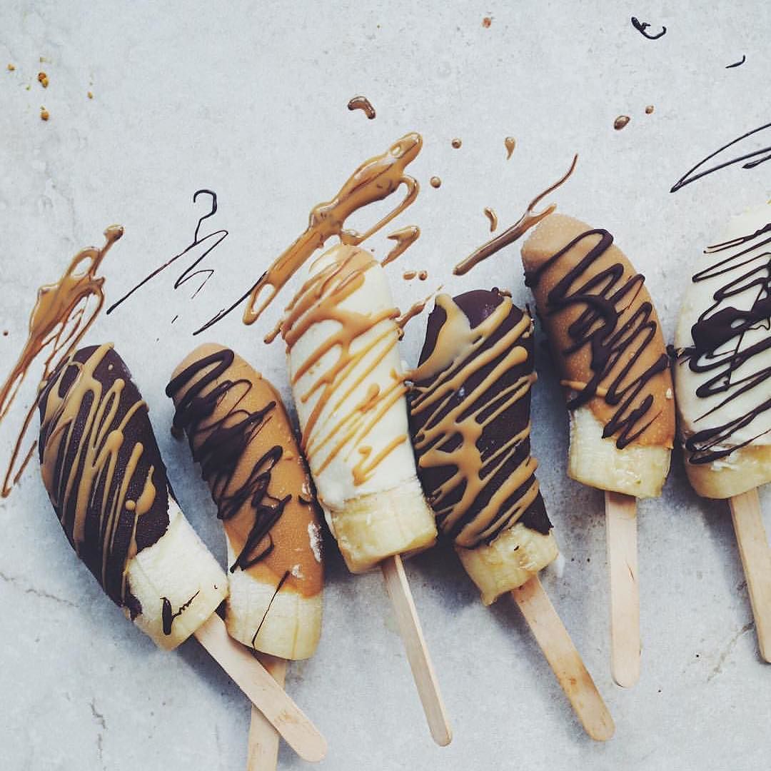 Raw_Choc_Banana_Pops_by__talinegabriel____Simple_recipe_Peel_5_x_bananas._Insert_paddle_pop_sticks_and_freeze_for_2-3_hours._Temper_white__dark_and_caramel_chocolate_separately_over_simmering_water._Dip_bananas_into_melted_chocolate_chocolate__and_pl.jpg