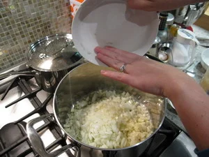 AFTER ONIONS GET TRANSPARENT (5-6 MIN) ADD ARBORIO RICE AND STIR