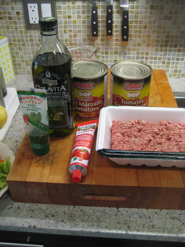TWO CANS SAN MARZANO TOMATOES, BASIL, TOMATO PASTE, 500 gms GROUND LAMB. OLIVE OIL