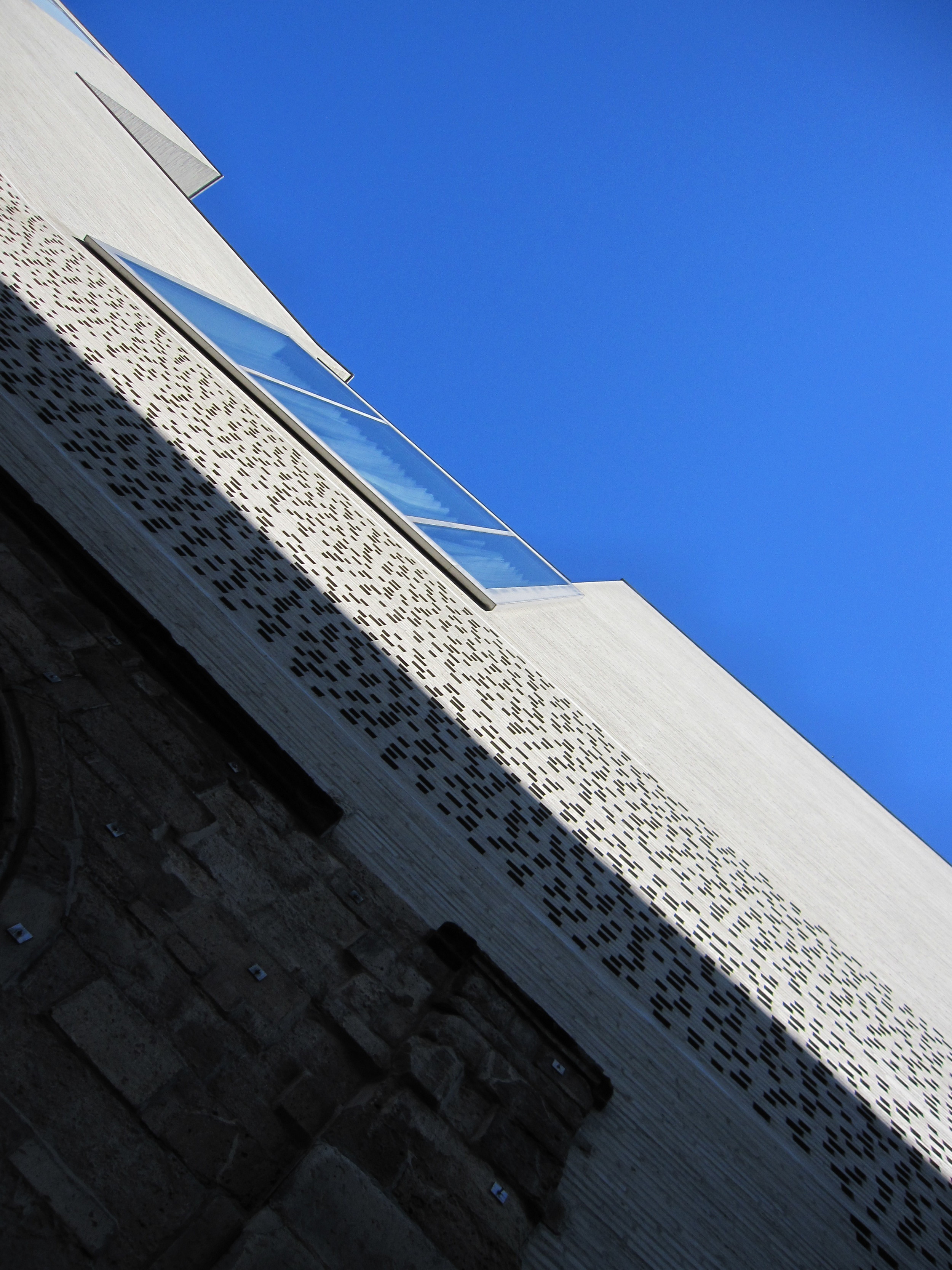 THE WINDOW IS ATTACHED TO THE BUILDING FACE: