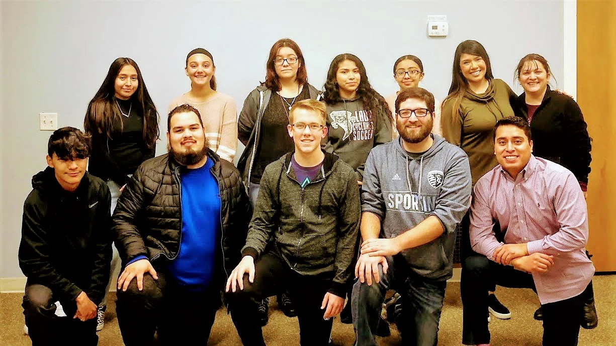 Michael Pollock (second from right on the bottom row) is pictured here with the youth and other volunteers from Teens Adelante.