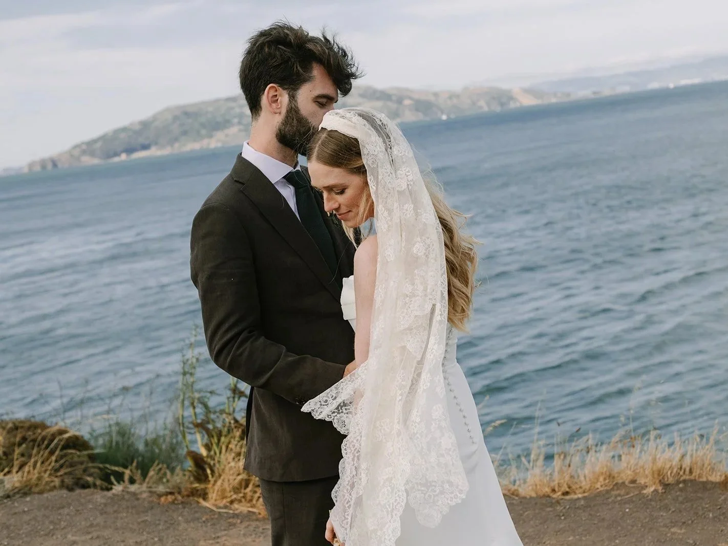 A windswept Cavallo Point Lodge wedding in Sausalito with sweeping Golden Gate Bridge views, lush wild florals, and a warm California color palette—captured through candid storytelling and film and digital photography.