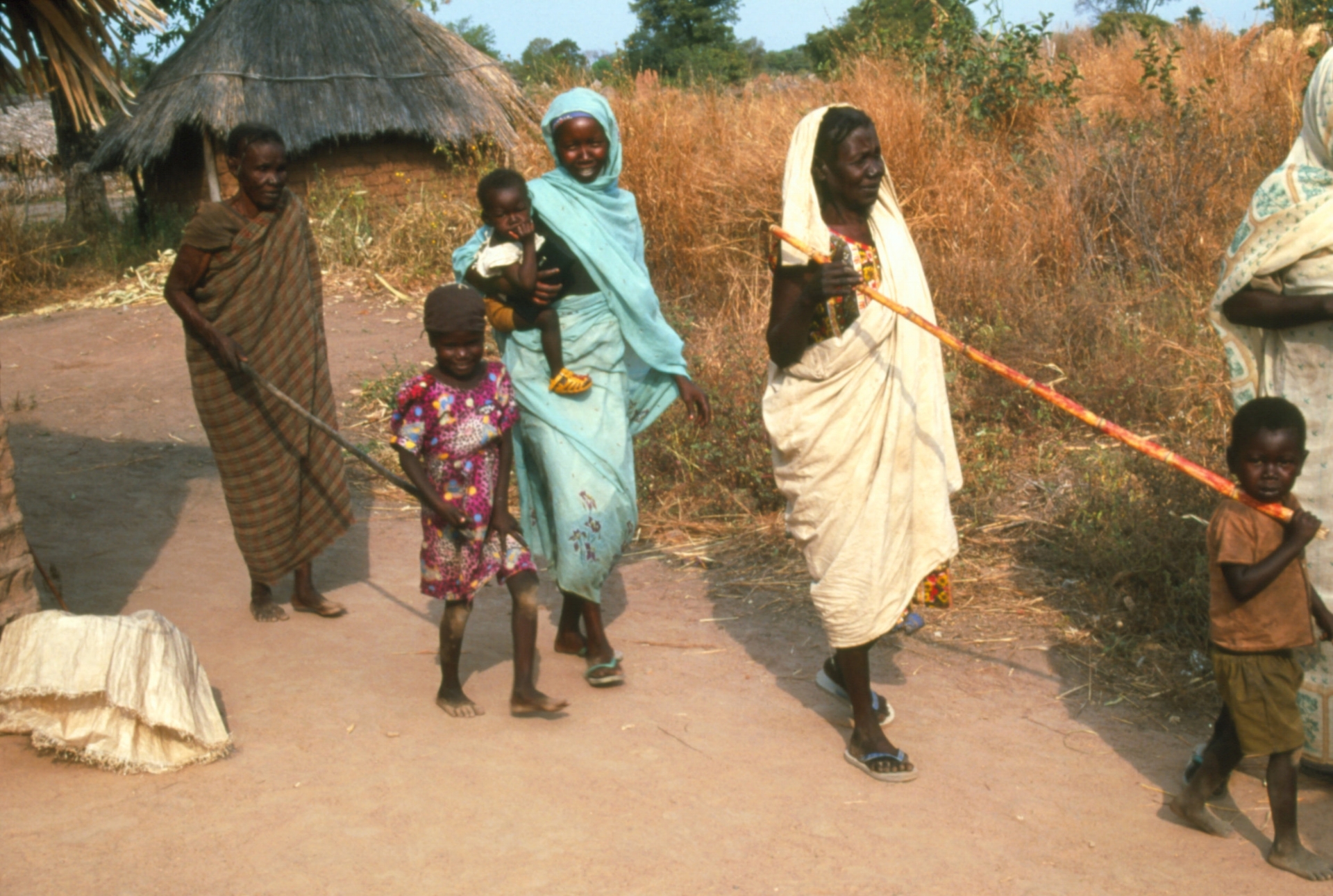 Children leading their parents who have been blinded by onchocerciasis
