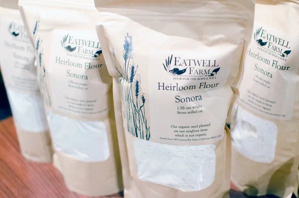 Our Heirloom Sonora Wheat Flour can be purchased as an add-on item to be delivered with our CSA boxes, at the Ferry Plaza Farmer's Market in San Francisco on Saturdays, or through our webstore to be shipped in the US. Photo Credit: Kelly from A Side of Sweet .