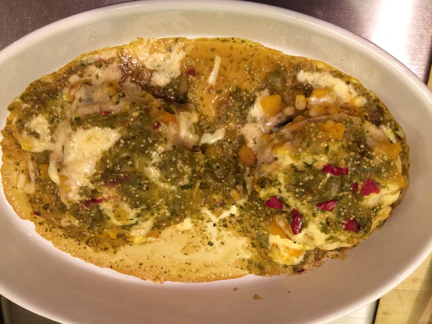 Nancy, a CSA member, sent us this photo of the butternut enchiladas she cooked. She wrote, " I love to pick up my box then make dinner "out of the box." Turns out I had pretty much everything! I still had some serranos which are the red bits on top of the enchiladas. I also roasted some of the sweet peppers and put chunks into the squash. Served with w a ring of lettuce & lemon, Really delicious. Yogurt topping. I made them "New Mexican" style, open faced. We have excellent local tortillas but they are too small to roll. And I find the corn ones often break anyway, so this is a nice solution. If one wants, a fried egg on top is a natural with this style enchilada!