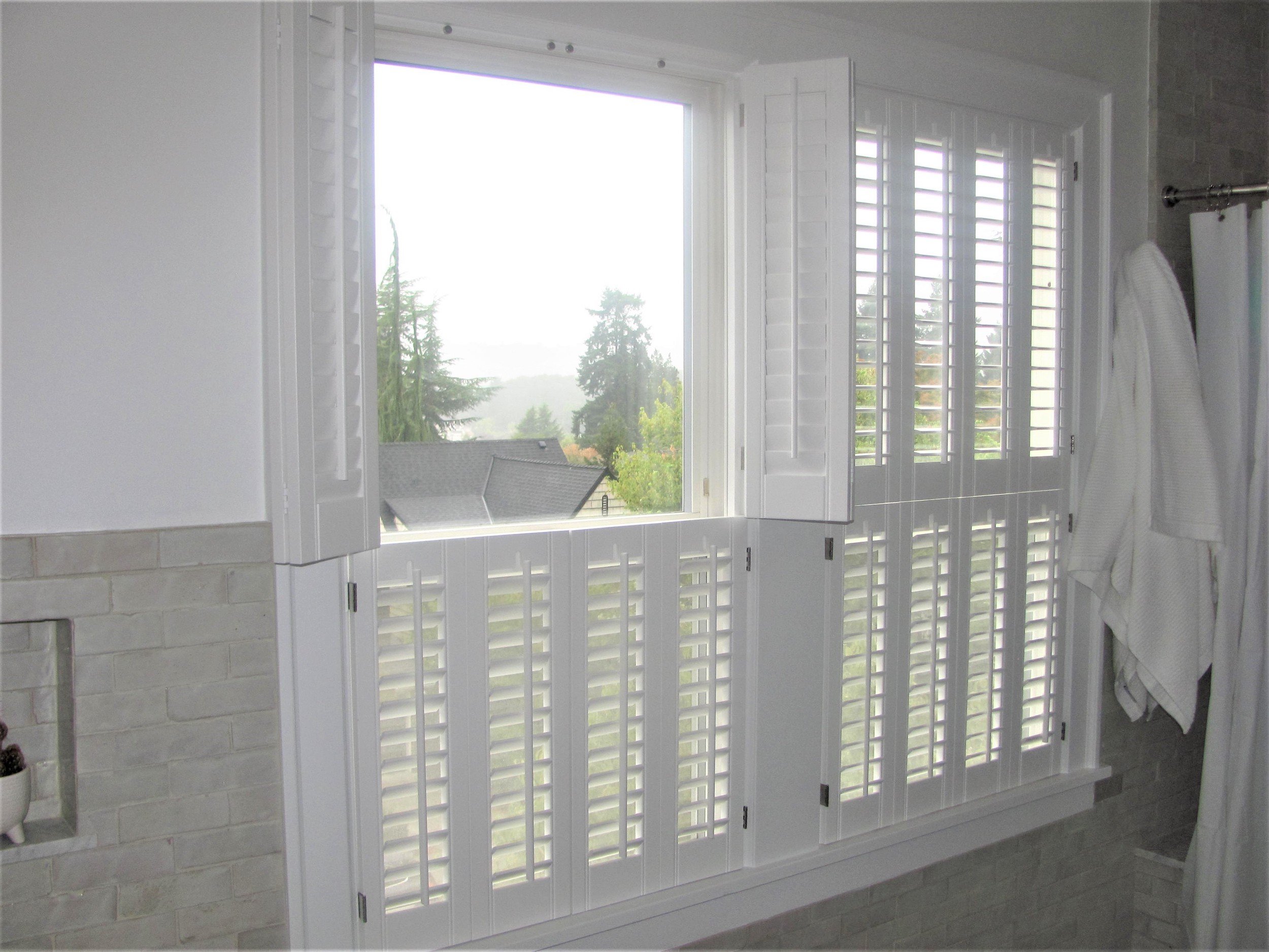 Bathroom shutters hinged open