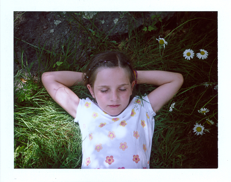 Madelyne laying in grass.jpg