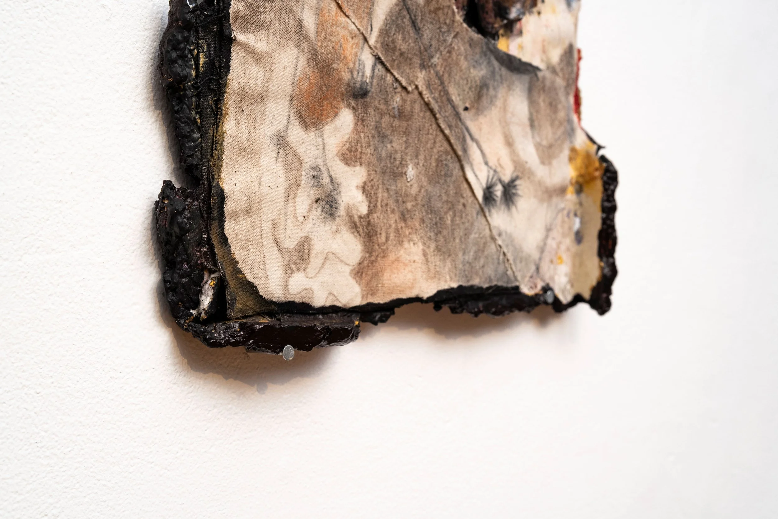 Years pile into one dull feeling at the bottom of your coat liner that splinters and each piece becomes decades that you never want to end (detail view) Mixed Media 13” x 16” x 2”