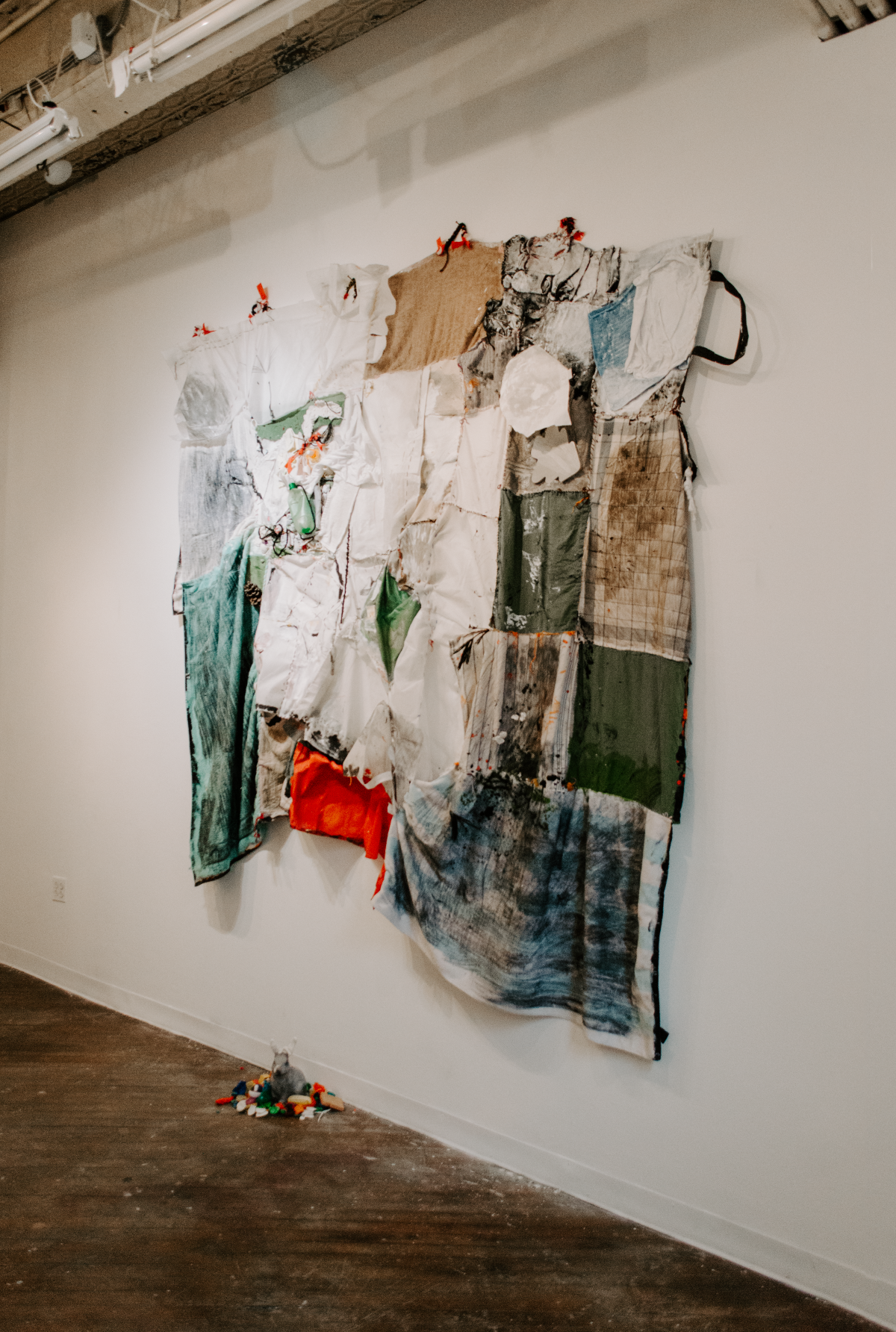 Installation view of Hold On, I Love You, a solo installation at Pink Noise Projects in February 2025. Hold On, I Love You explores early parenthood and navigating relationships with self, loved ones, strangers, ecosystems, and animals in tod