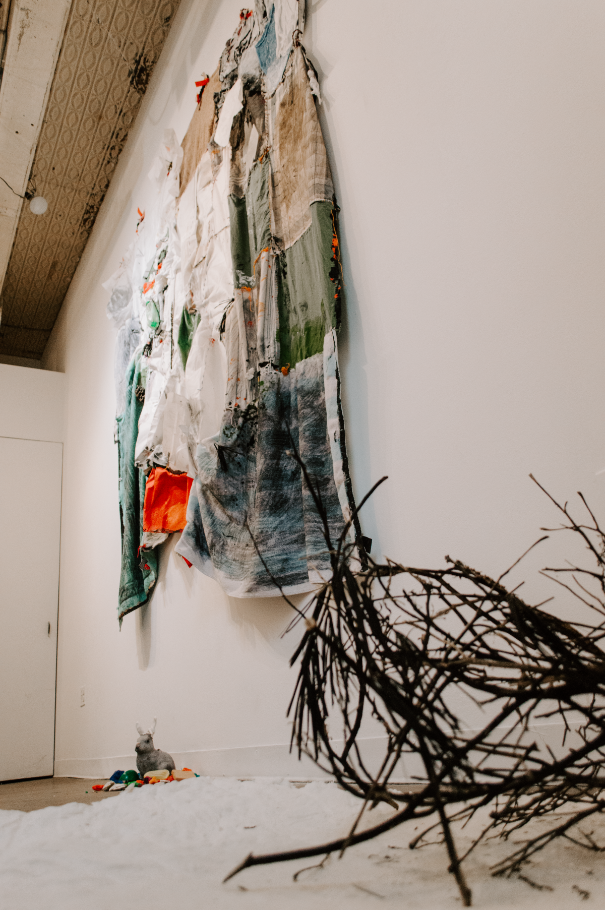 Installation view of Hold On, I Love You, a solo installation at Pink Noise Projects in February 2025. Hold On, I Love You explores early parenthood and navigating relationships with self, loved ones, strangers, ecosystems, and animals in tod
