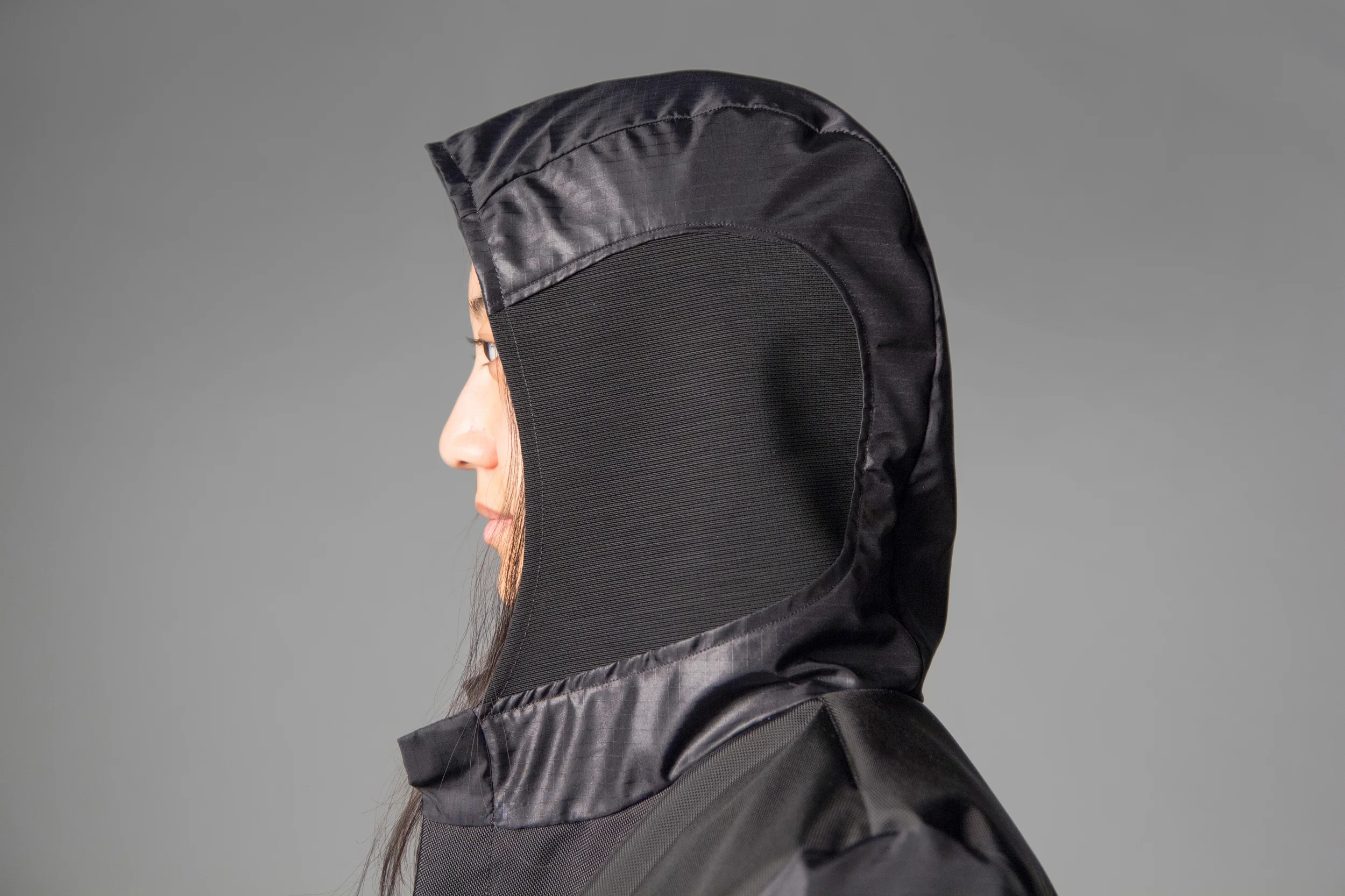 See-through mesh hood side panels allow for maintained field of vision and hearing, while still providing the hood's protection