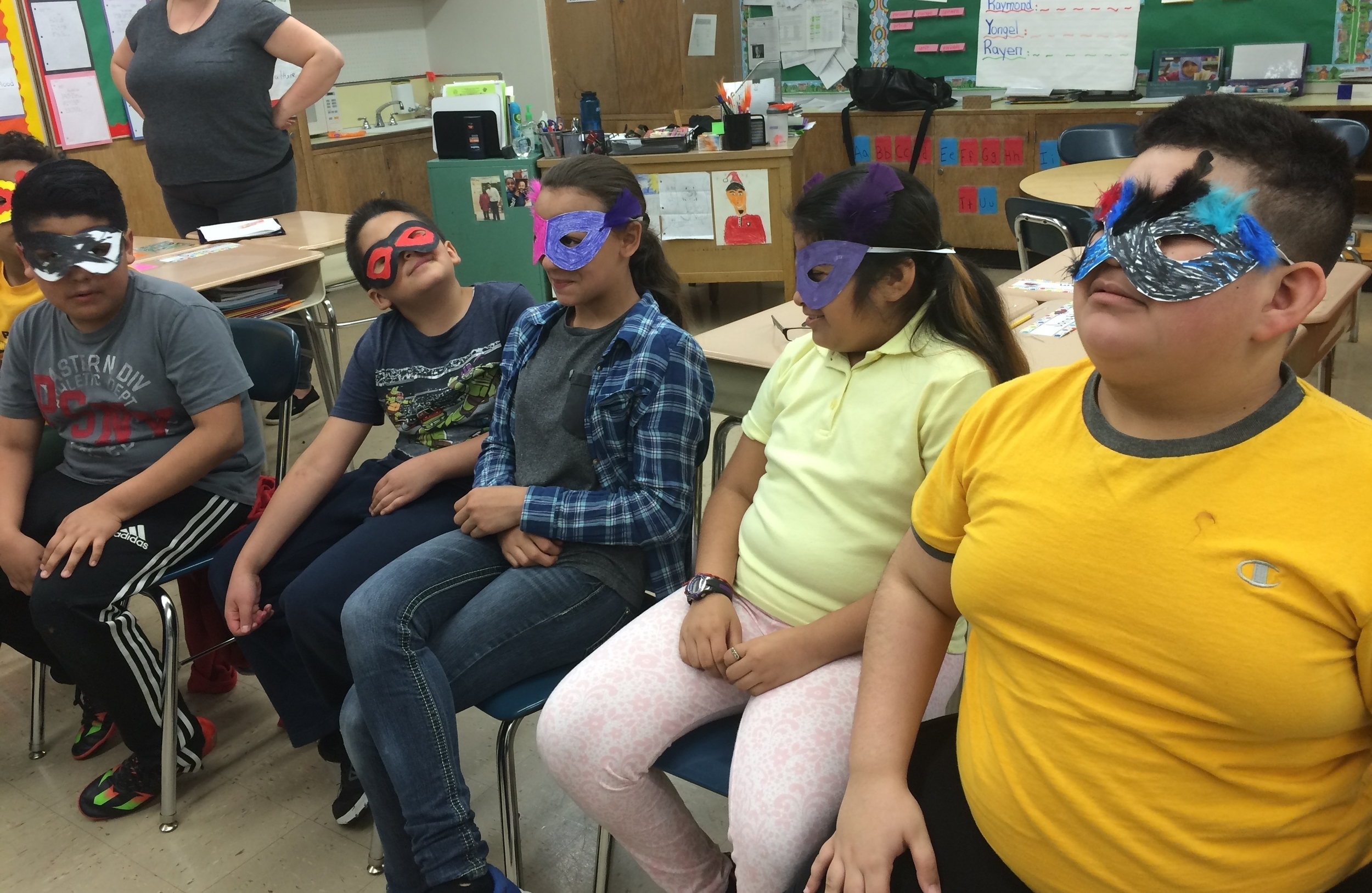    5th graders create their own superhero masks and characters at a Community-Word Project residency.   