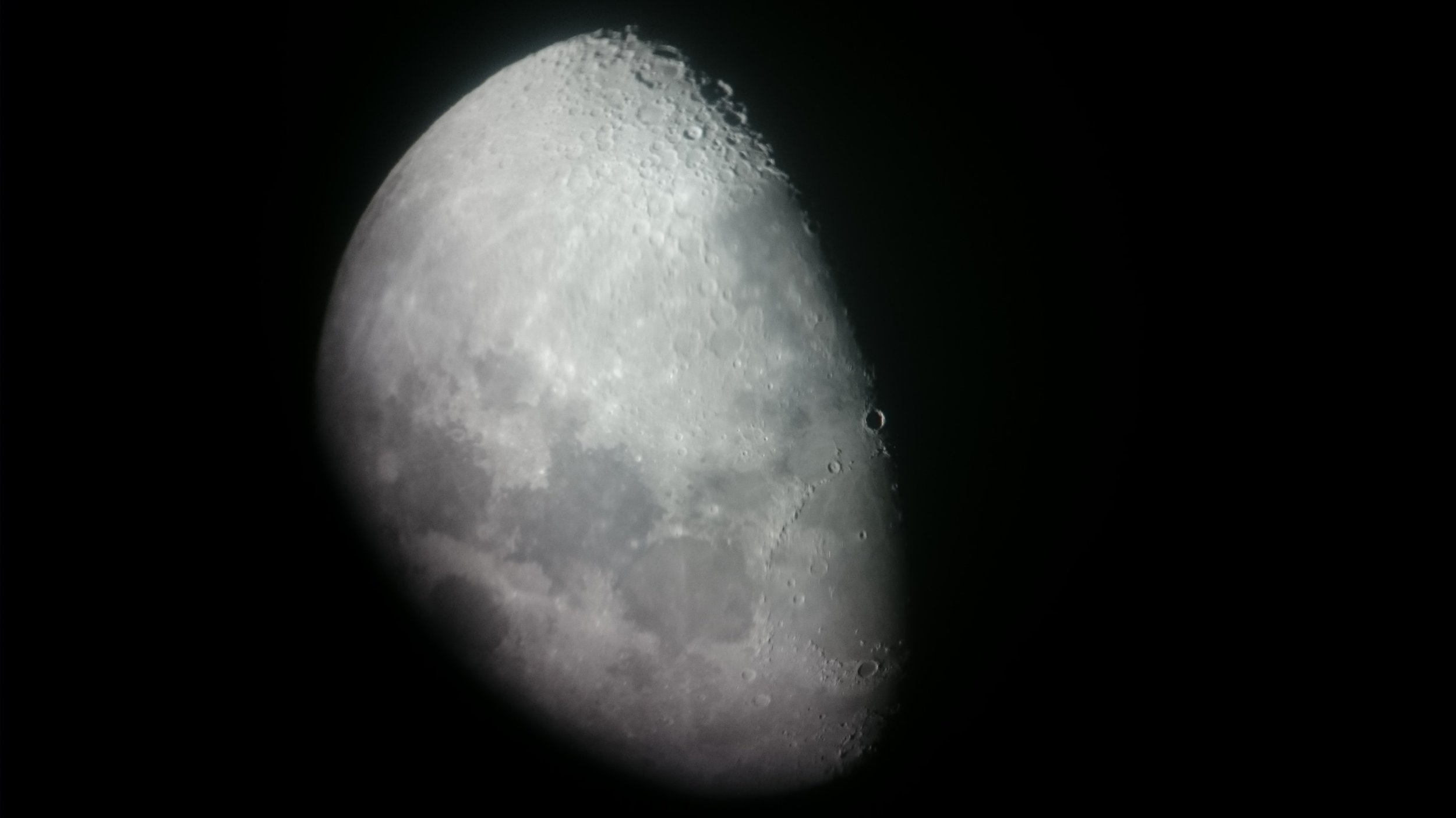 Moon photo through telescope.JPG