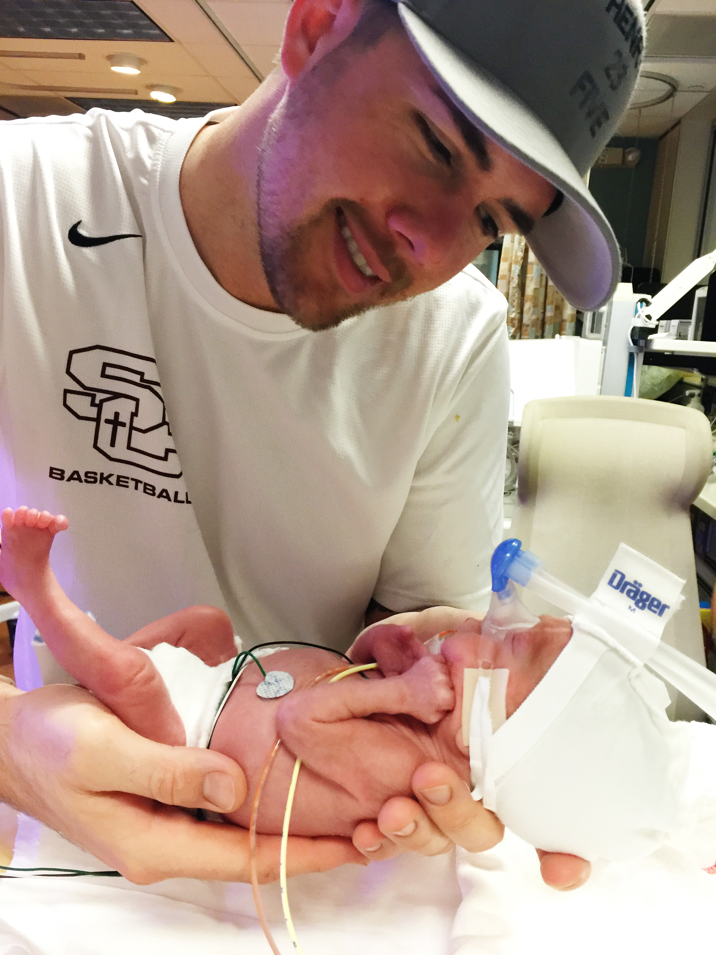 Here is Matt holding Henry up right before he gets weighed