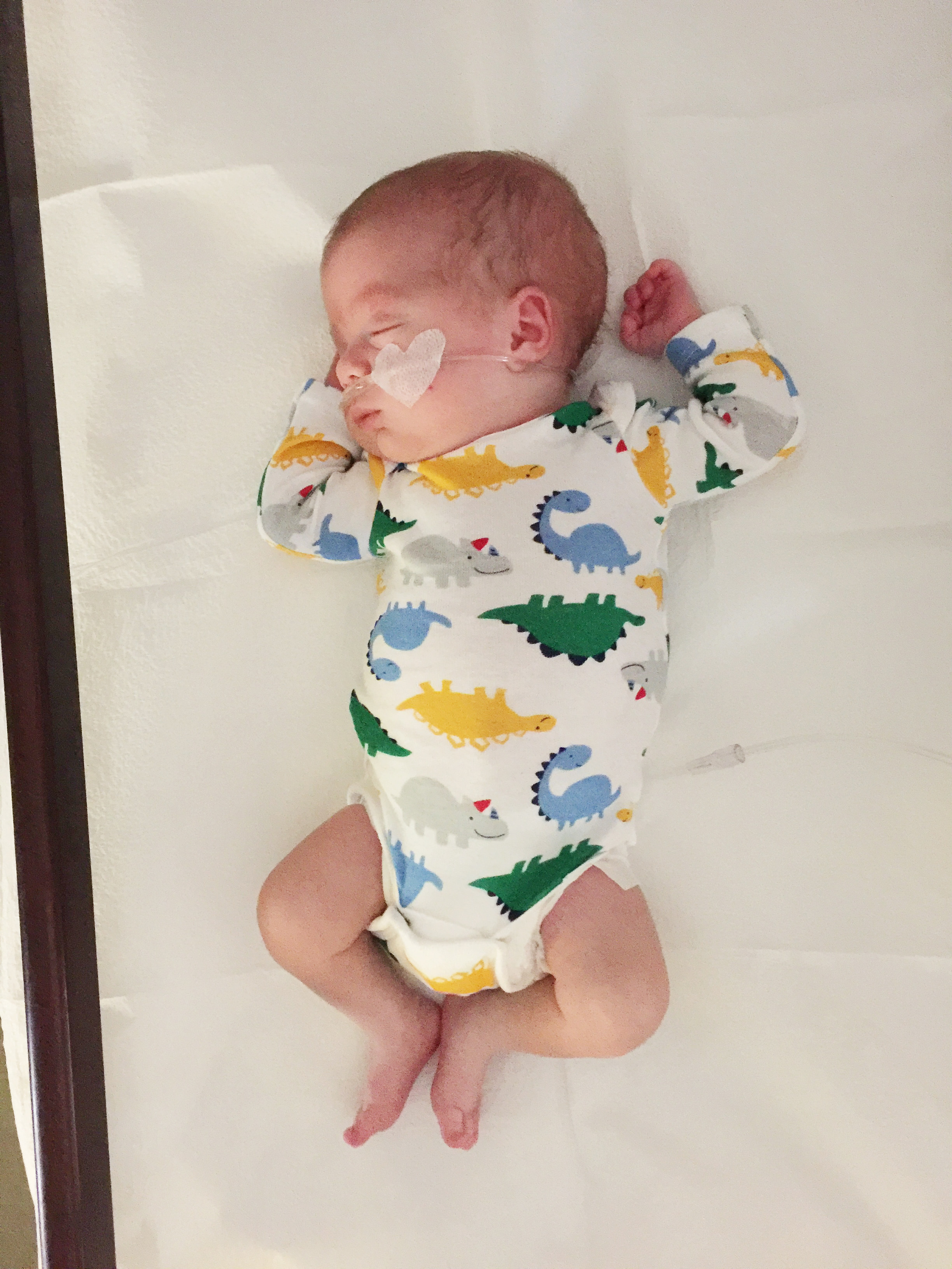 Here he is at his second Dr appointment... busting out of that preemie outfit!