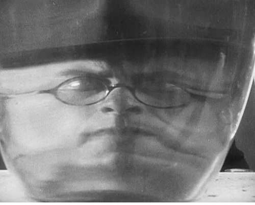 Sergei Komarov as Chiche, the evil capitalist, as seen inside his "death lab"