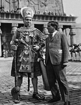 Emil Jannings, in costume as Amenes, Pharaoh of Egypt, and director Ernst Lubitsch on the set.