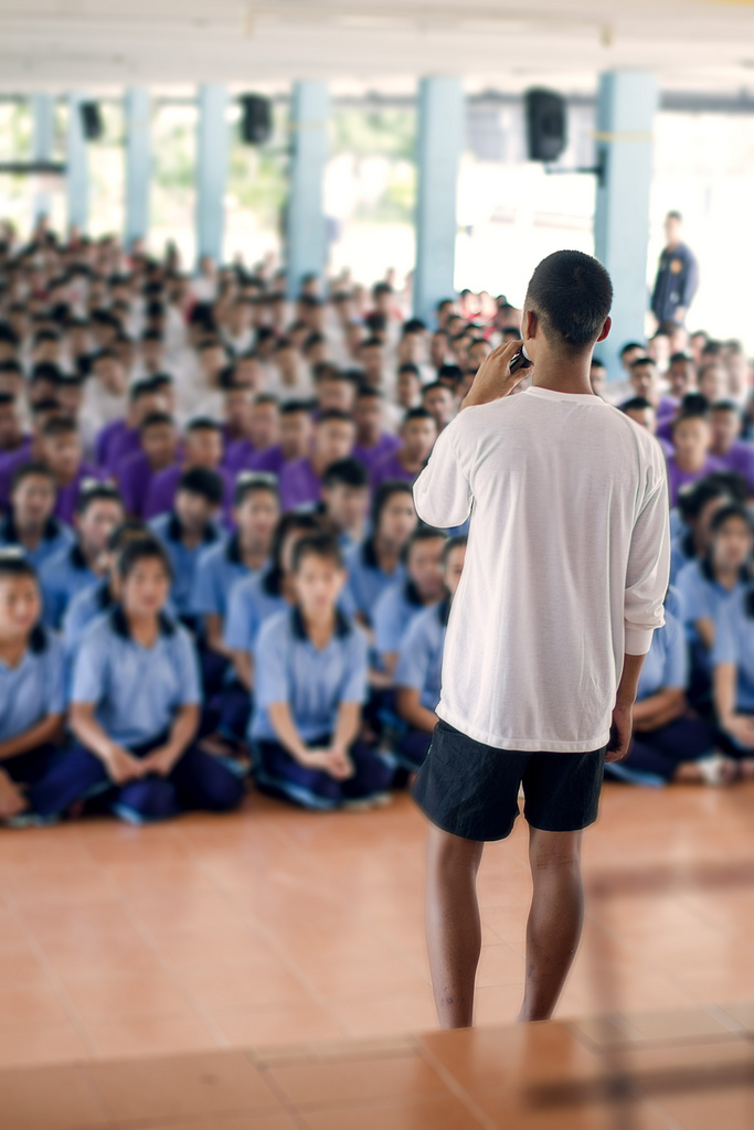 An inmate at the Mae Rim Juvenile Correction Facility is asked by officers to lead his peers in acapella song to welcome guests from the Sports Friends and Radical Grace teams in Chiang Mai, Thailand. To protect their privacy - and future prospects - we were asked not to publish the faces of any of the teens at the event. 