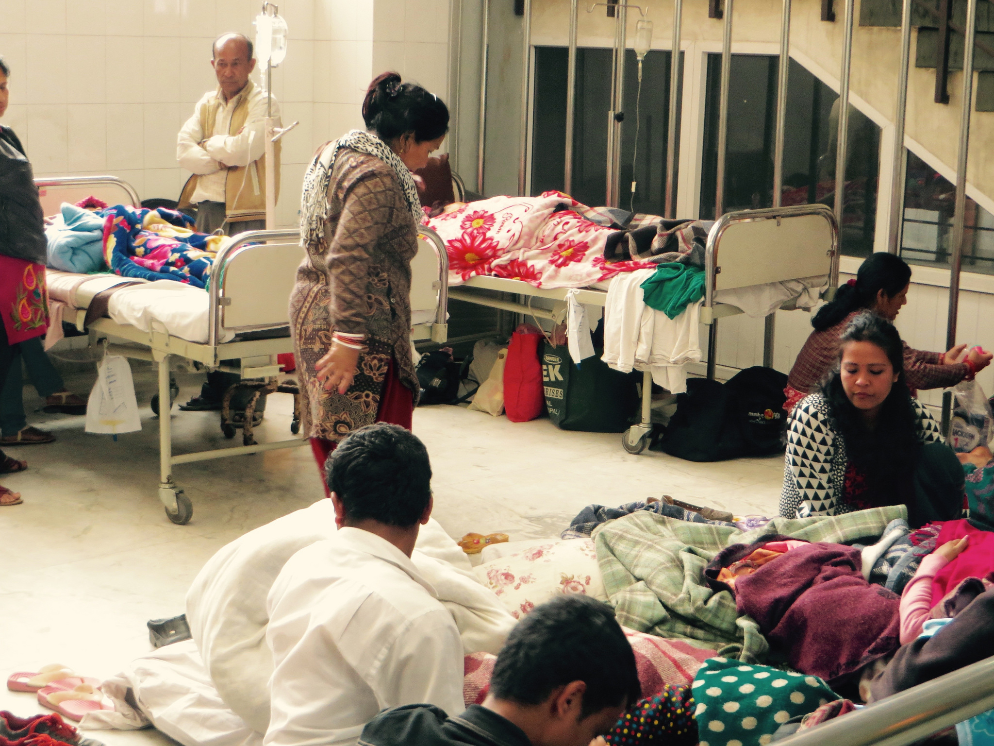 Many patients are being treated in hallways and lobbies at Kathmandu's Patan hospital. Photo by Gabriel Jens