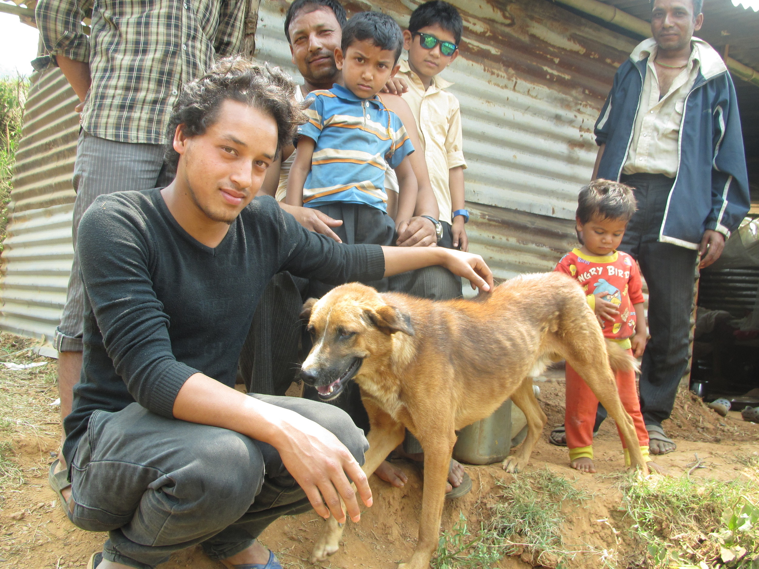 Gopal and his dog, Khaire who warned the family about the coming earthquake - Photo courtesy of UMN.