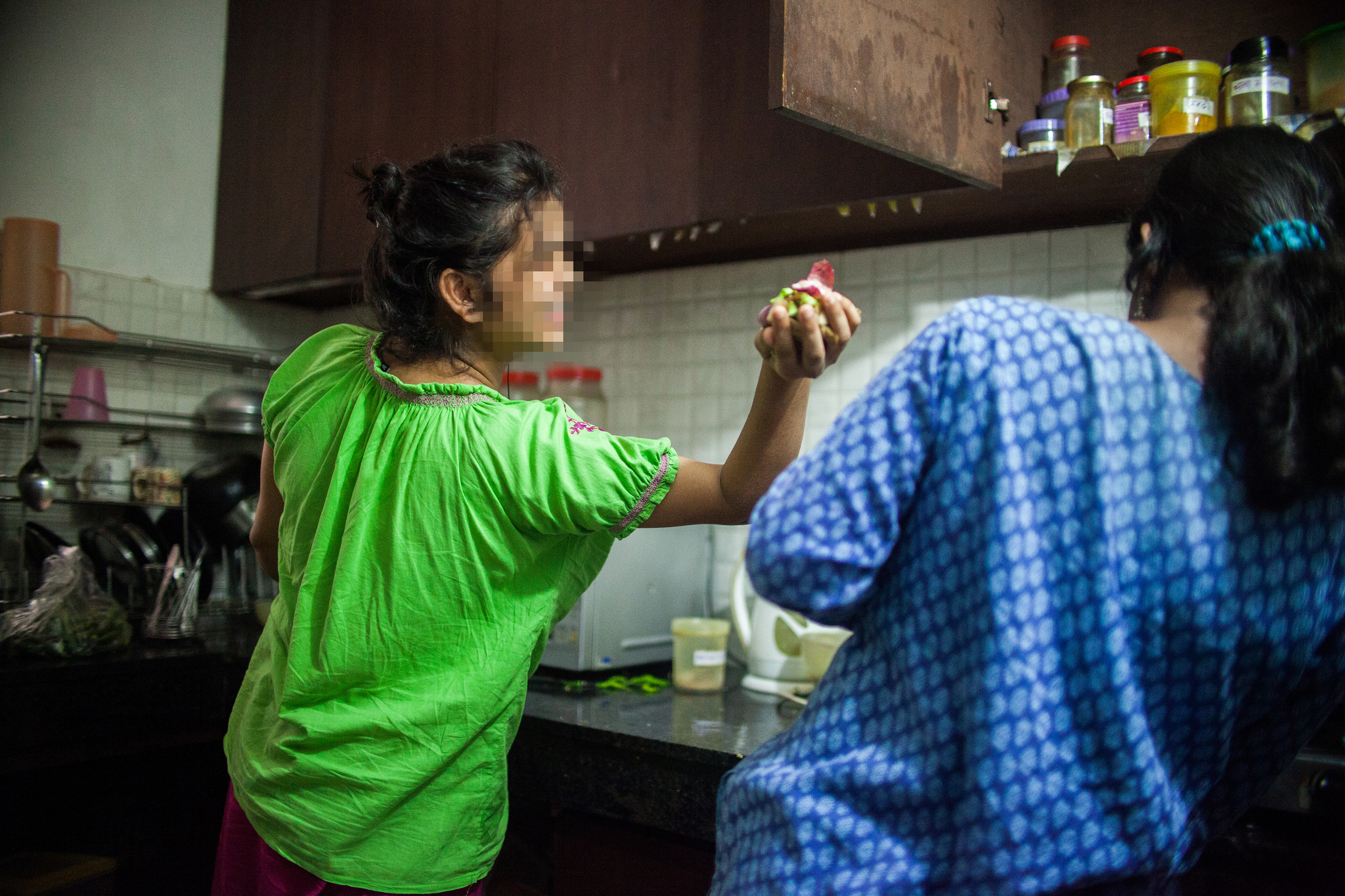 Two of the women prepare dinner together as part of their daily chores. One of the most life-giving aspects of Beauty for Ashes is the sisterhood fostered between the girls. "I have found happiness playing with my sisters here. They are very important to me," Shreya said.