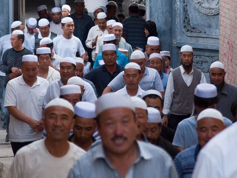 Muslim Hat men returning from prayer - Photo courtesy of Evgeni Zotov