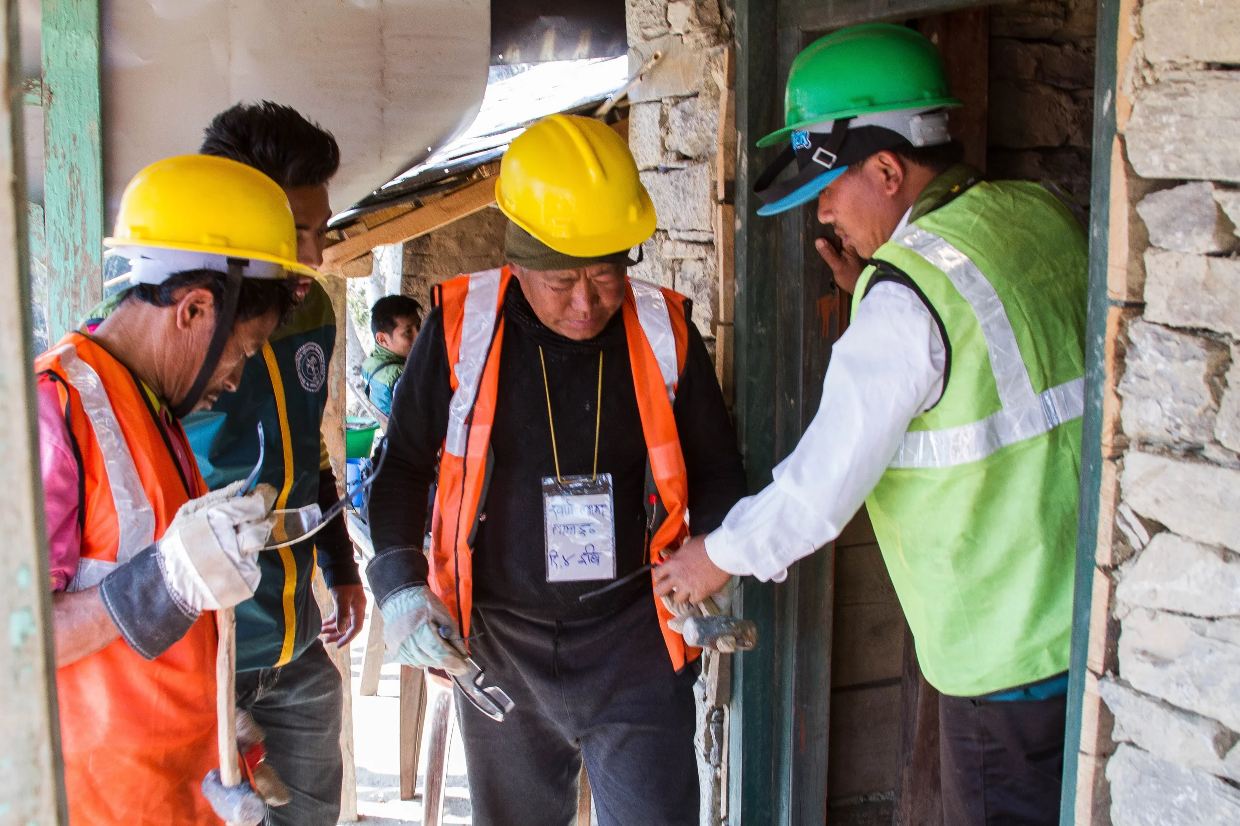 Even if Nepalis in rural areas cannot afford new building materials, they are still able to apply techniques such as how to test for landslide-prone soil. “Their motivation to learn about earthquake-resistant building techniques encourages me,” said Rajesh Maharjan, one of UMN’s mason trainers. - Photo by Denise Poon.