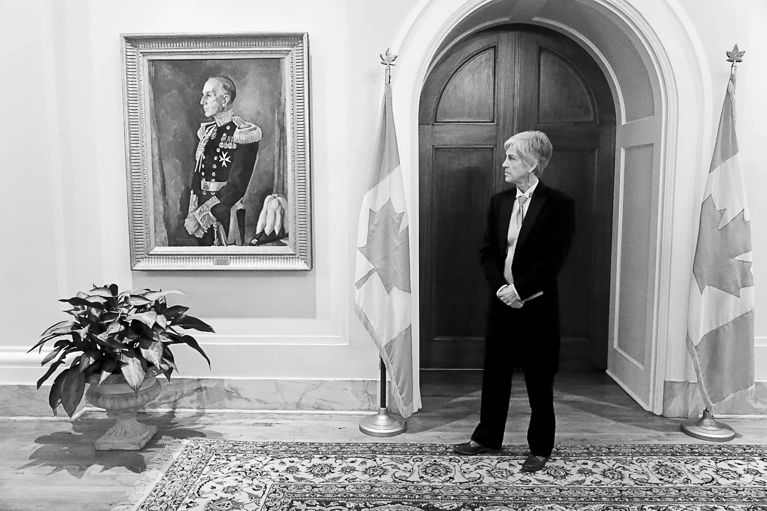 Professor Lorraine Gilbert contemplates the official portrait of former Governor General Georges Vanier