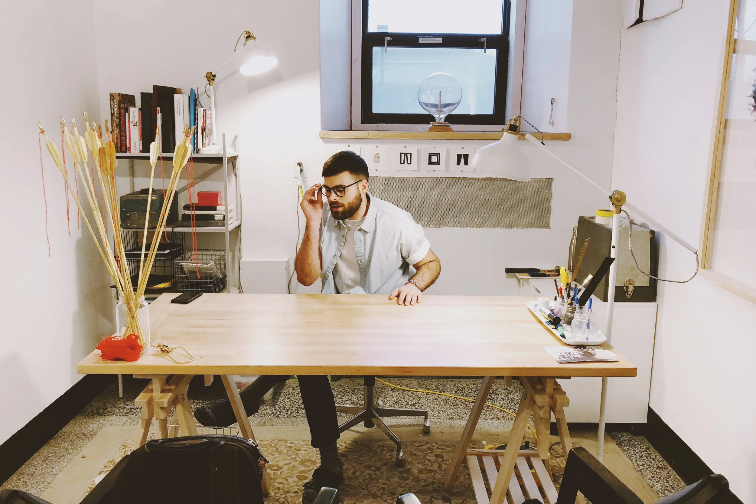 MFA Grad Sam Loewen in his basement studio