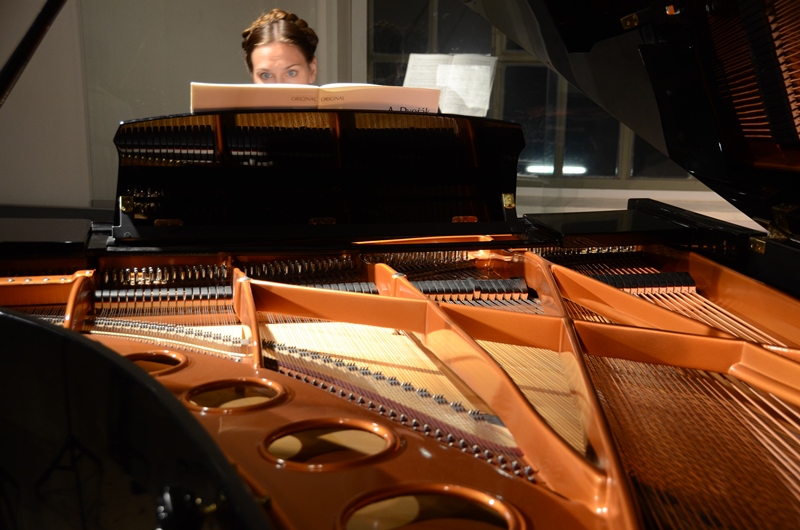 Chanda VanderHart behind piano strings