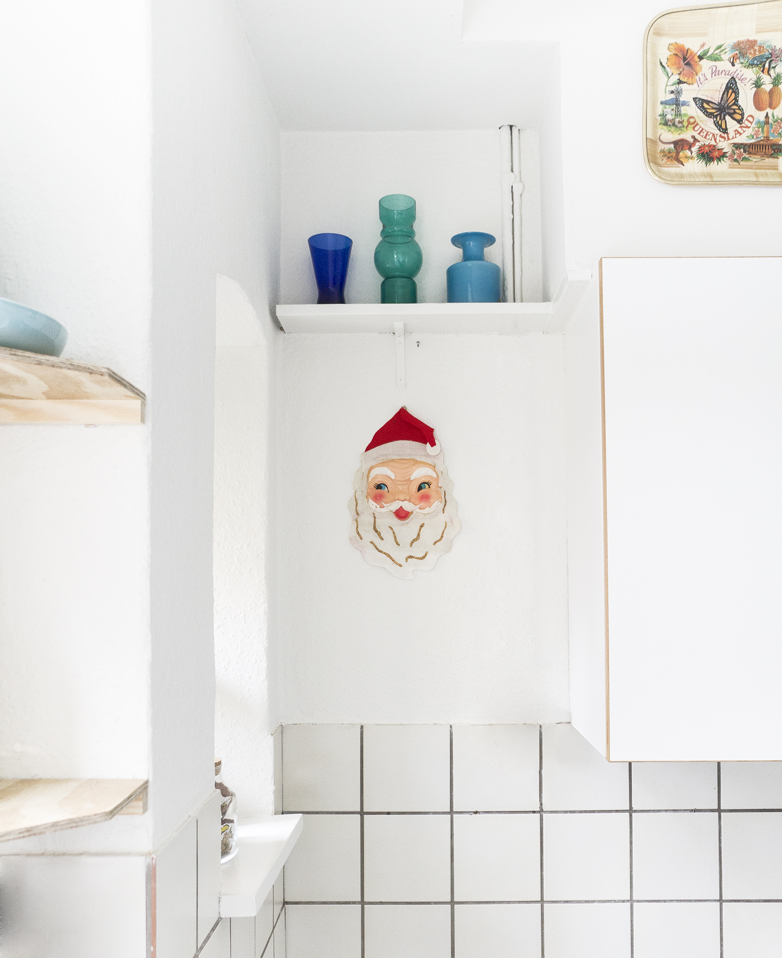 An old Santa Claus with a felt beard and rosie cheeks