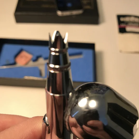 The crown cap in close up that fits nicely on my airbrush.