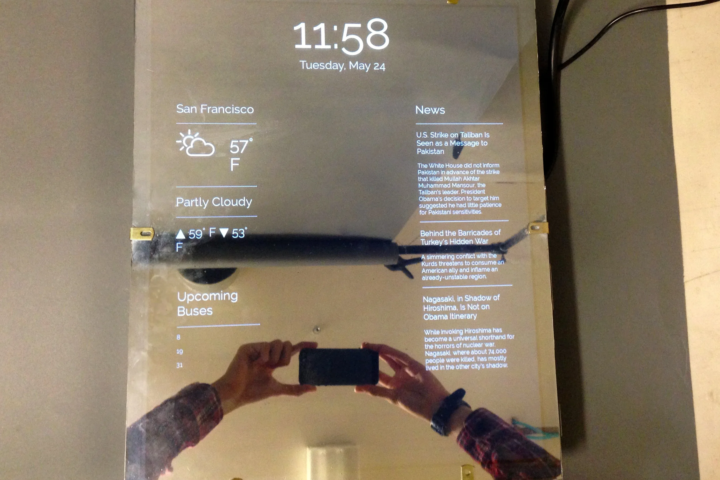 Sydney and Leo made an internet connected mirror that gives you the time, weather, NYT top stories and upcoming muni buses.