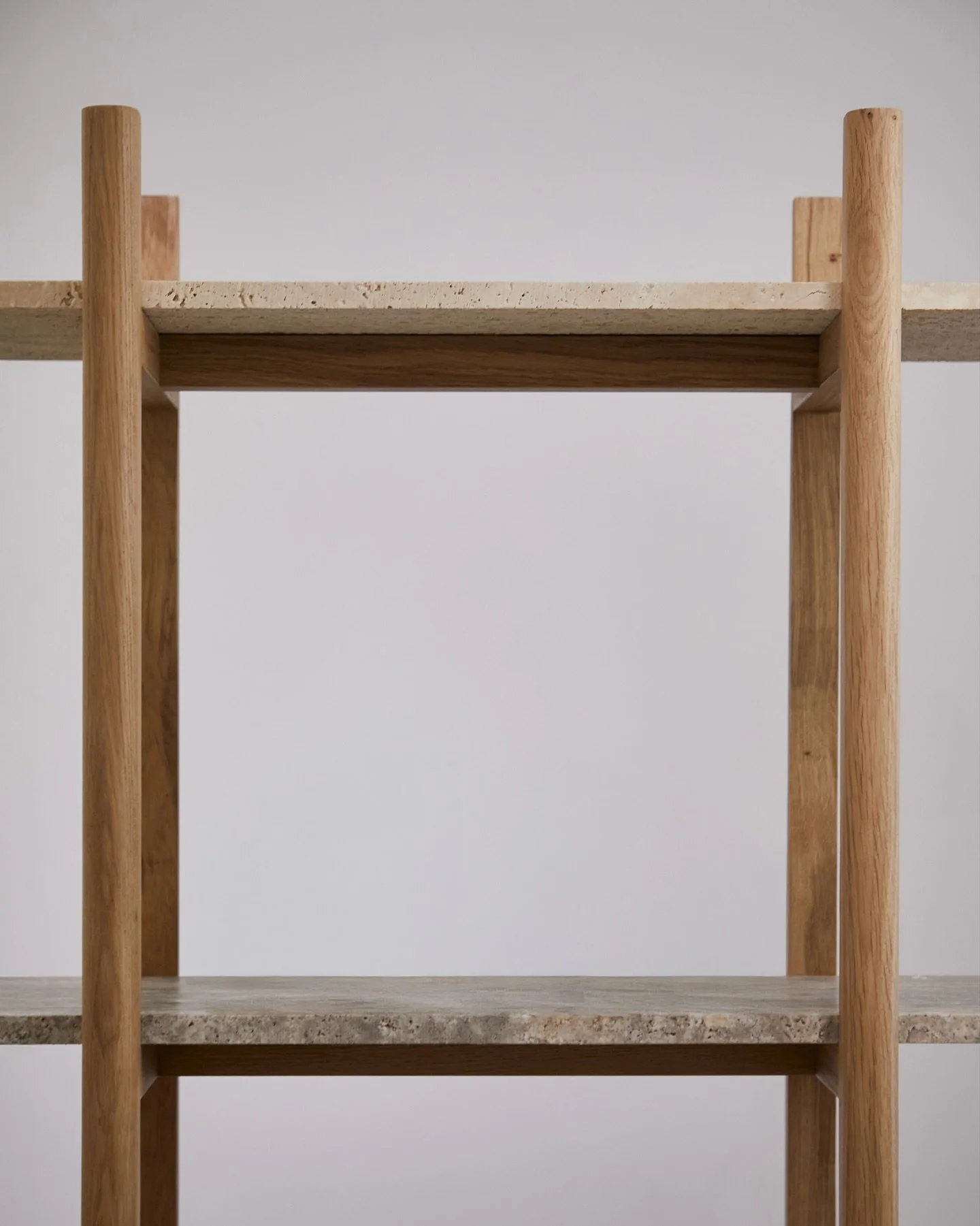 The Connections shelf showcases the unique beauty of travertine marbles sourced from @van_den_weghe offcuts, paired with local oakwood from @sonian.brussels. 
It's part of a furniture series that highlights the connection between reclaimed marble and