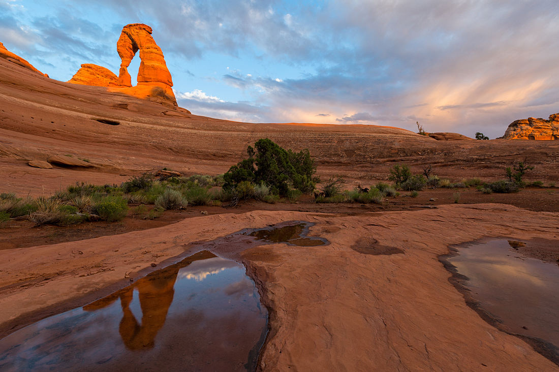 Delicate Arch Reflecting in Pothole at Sunset, Utah