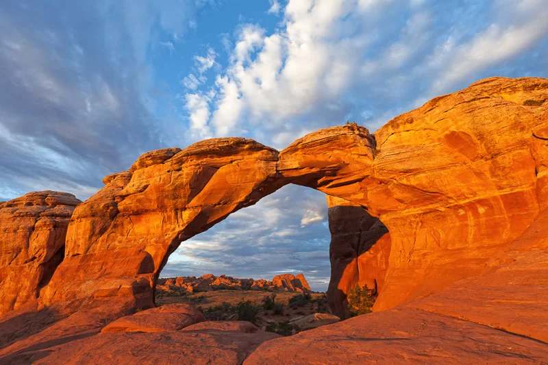 Clouds at Sunrise Over Broken Arch, Utah