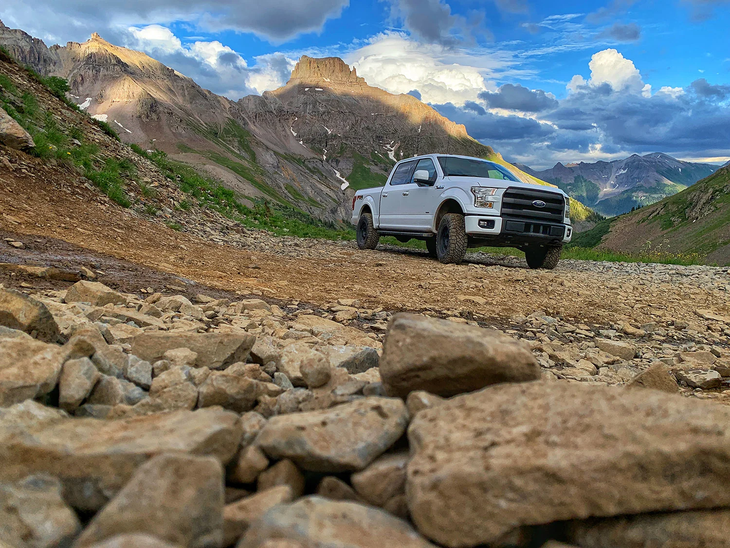 Betty White laughing at rocks on the trail in Yankee Boy Basin near Ouray, Colorado.
