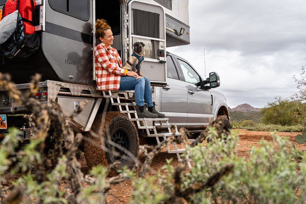 Woman Smiling at Pug Dog from Overland Camper in Superstition Mountains.jpg