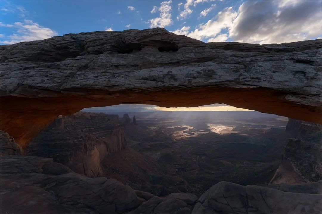 Mesa Arch Framing Sunbeams on White Rim.jpg