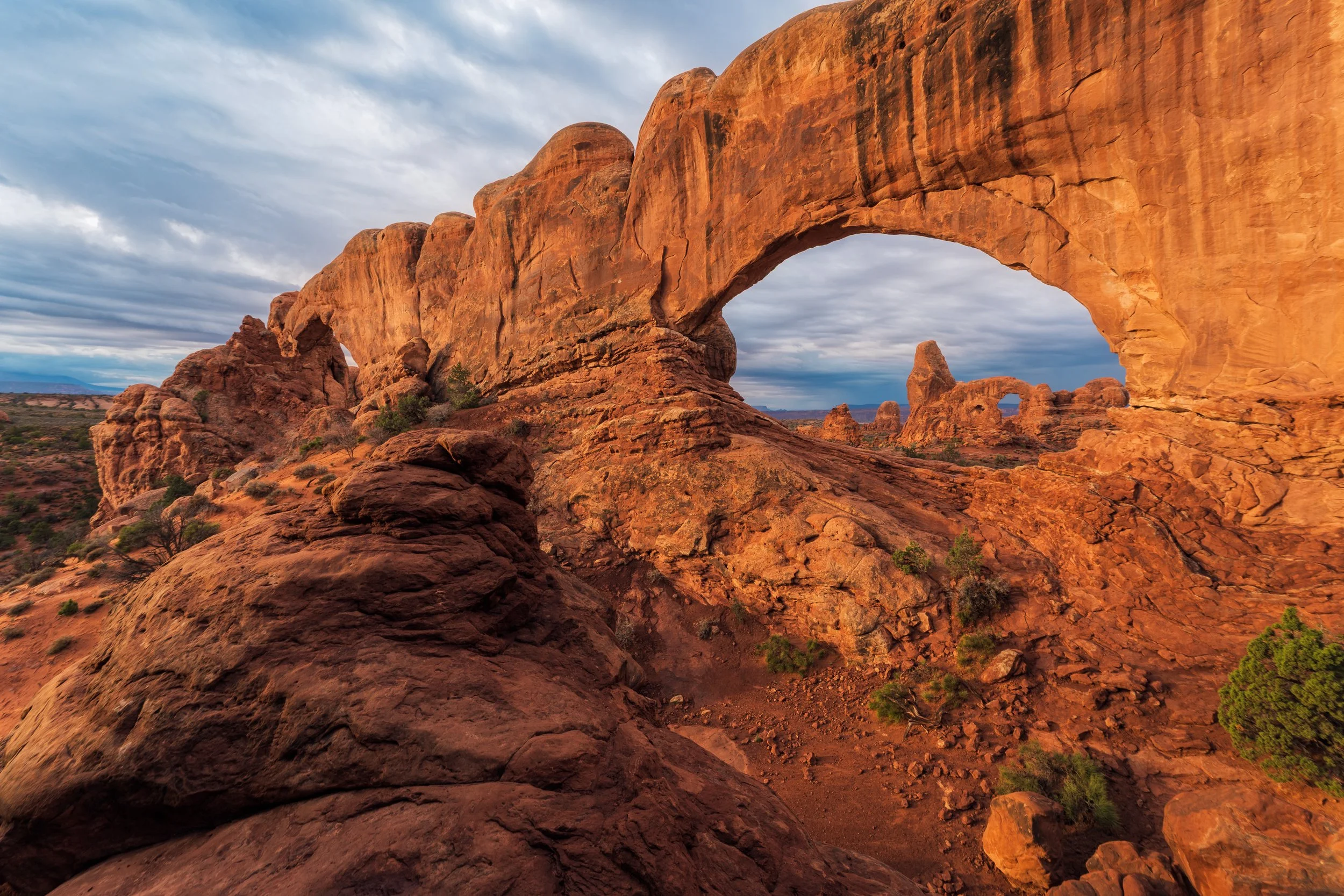 unrise light on North Window and Turret Arch during an Arches National Park photography workshop in Moab, Utah.