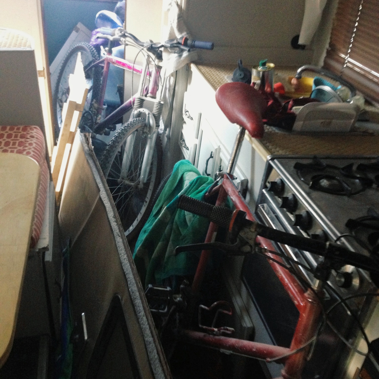 All our belongings, including the door, piled in the living area with us.