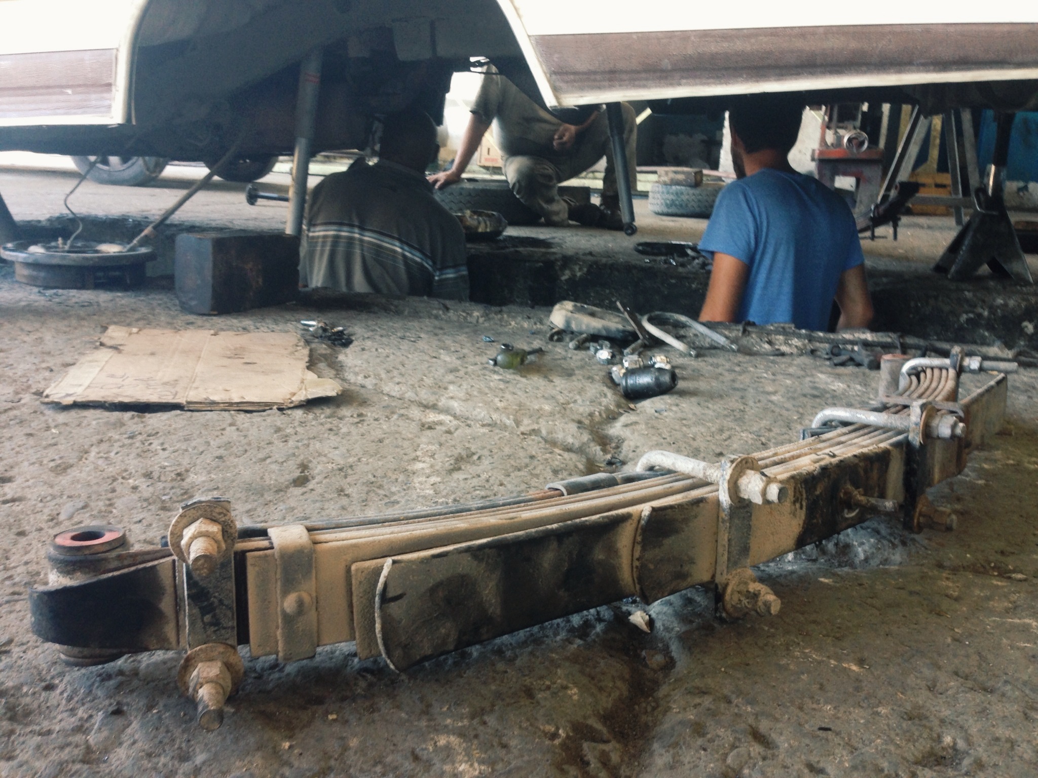 The whole rear of the Dolphin gutted, suspension parts all over.