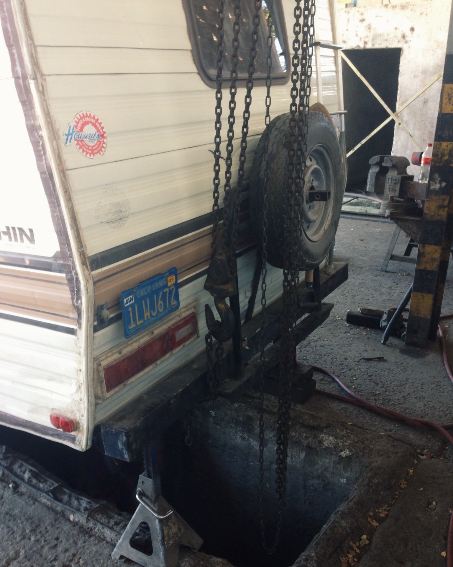 Very advanced lift system...a chain hoist!